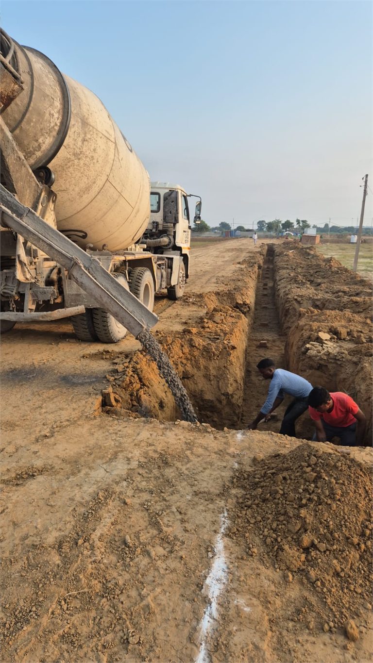 Supplied site photograph showing concrete work along an excavated trench